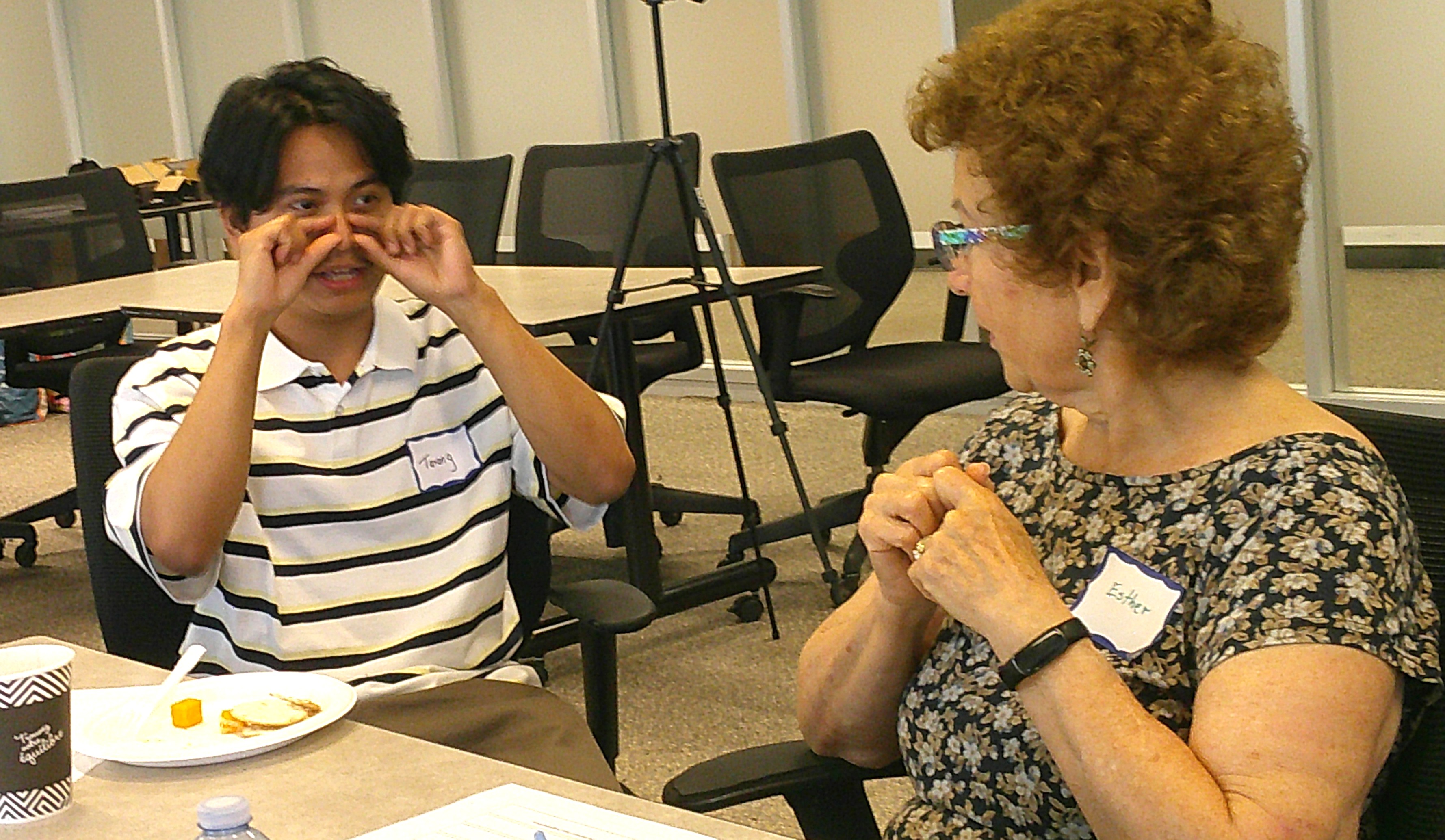 Workshop participants demonstrating and discussing ideas for wearable AirWear devices